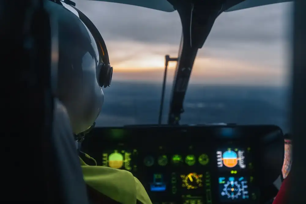 Commercial pilot operating aircraft at dusk illustrating CPL night privileges and operational authority under Canadian Aviation Regulations